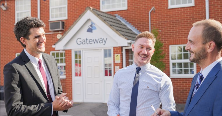 Gateway employees talking outside offices