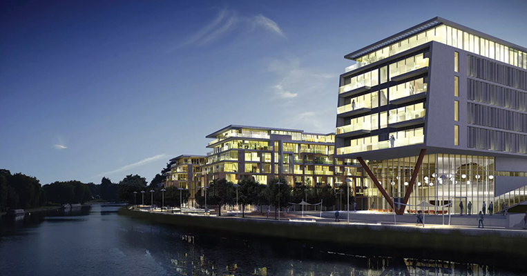 Archictectural buildings alongside river bank