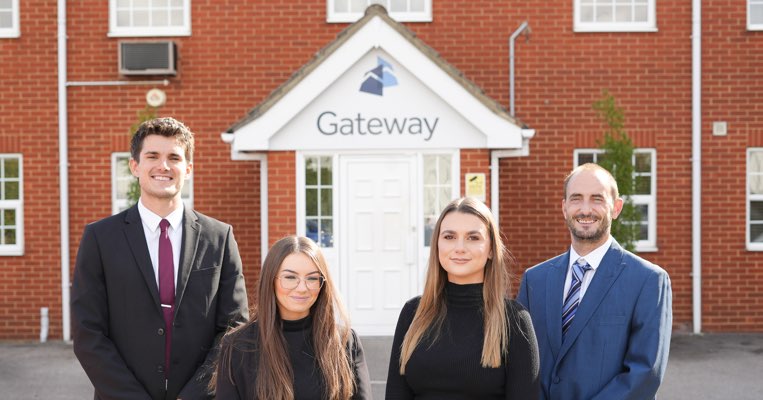 Gateway employees standing outside main office