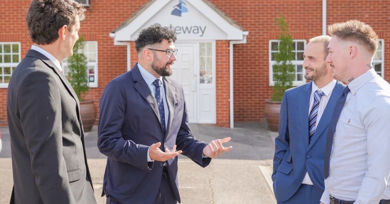 Gateway employees talking outside of offices