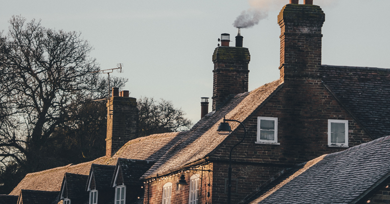 Row of houses with smoking chimneys