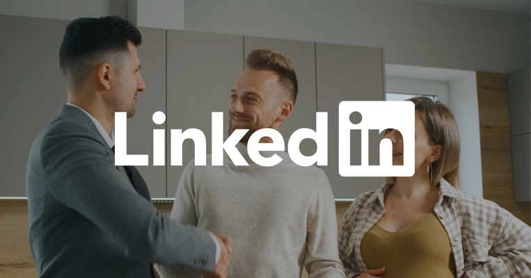 Property manager shaking hands with couple with LinkedIn logo