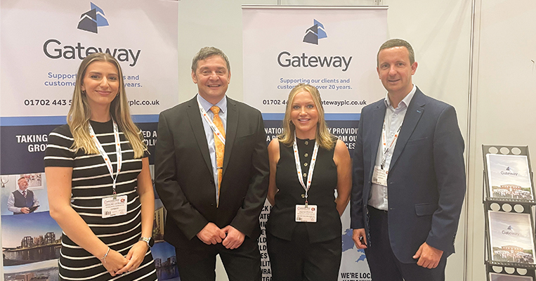 Gateway employees standing in front exhibition stand